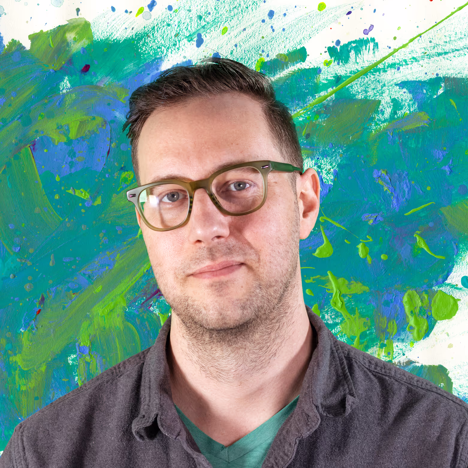 A man wearing glasses and a gray shirt